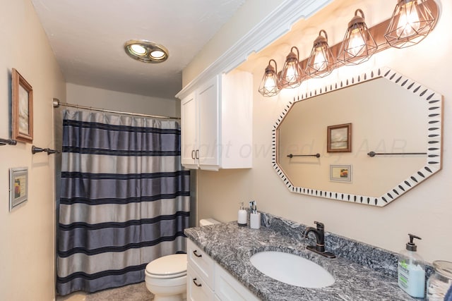 bathroom featuring toilet, vanity, and a shower with shower curtain