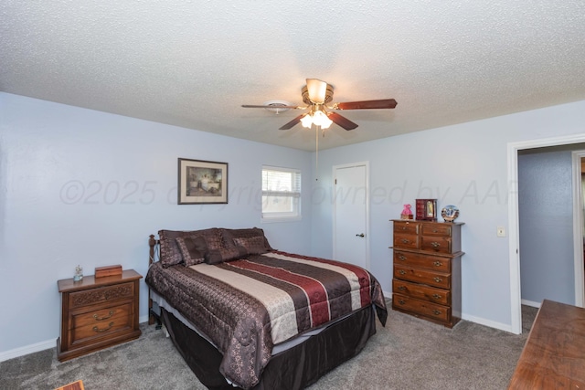 carpeted bedroom with a ceiling fan, baseboards, and a textured ceiling