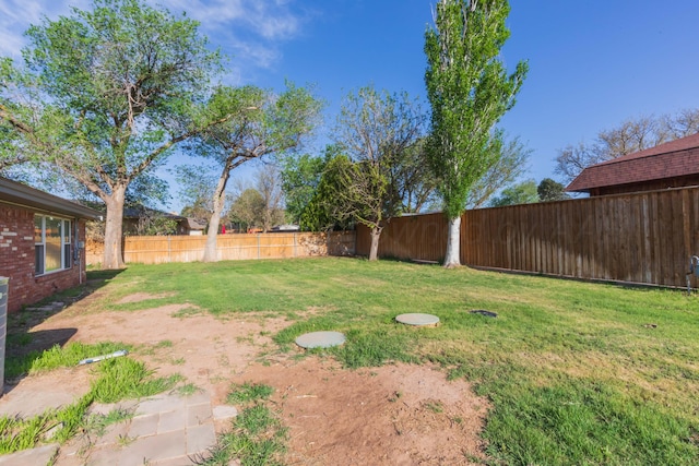 view of yard featuring a fenced backyard