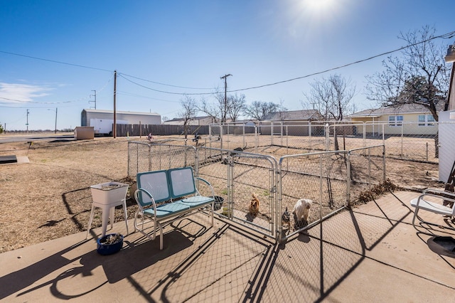 view of patio featuring fence and a gate