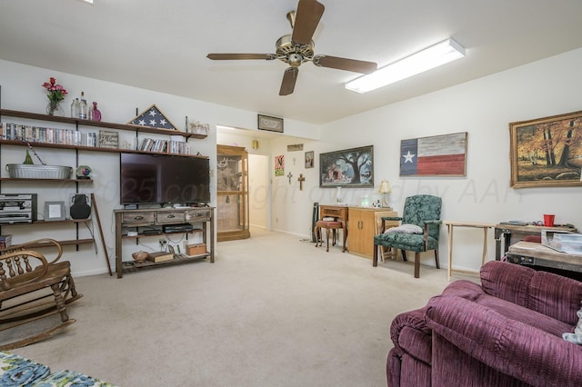 living room featuring lofted ceiling, carpet floors, a ceiling fan, and baseboards