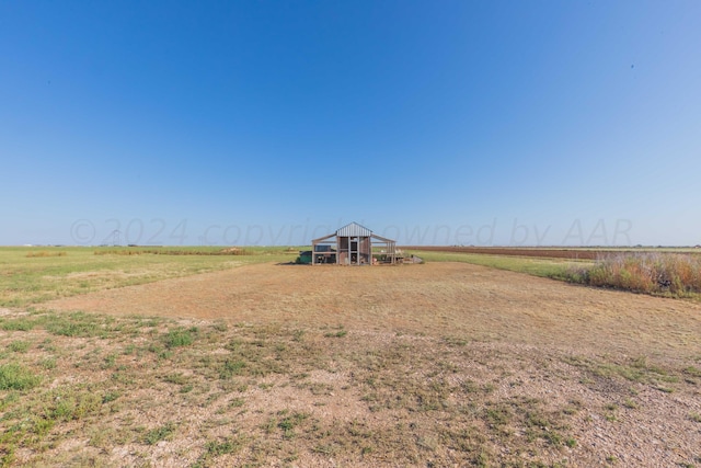 view of yard with a rural view