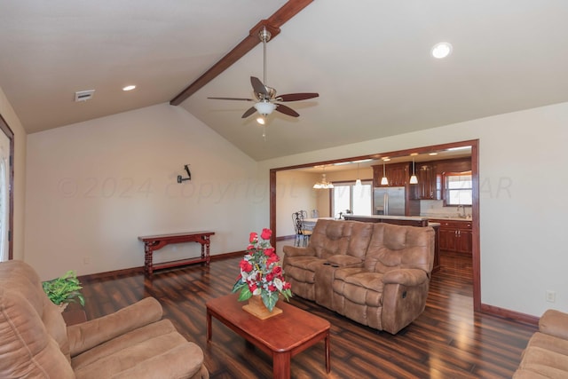 living room with lofted ceiling with beams, dark hardwood / wood-style flooring, sink, and ceiling fan with notable chandelier