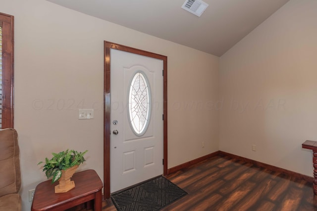 entryway featuring vaulted ceiling and dark hardwood / wood-style floors