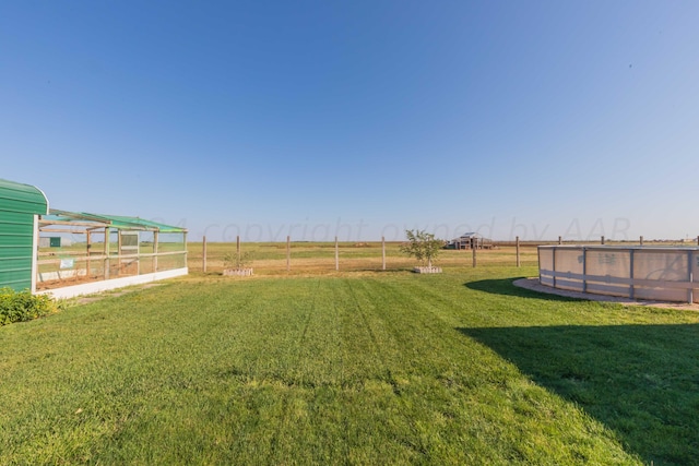 view of yard with a rural view