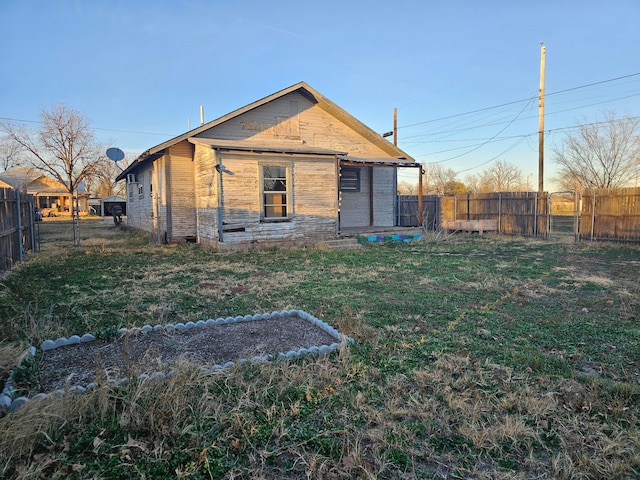 back of property with a yard