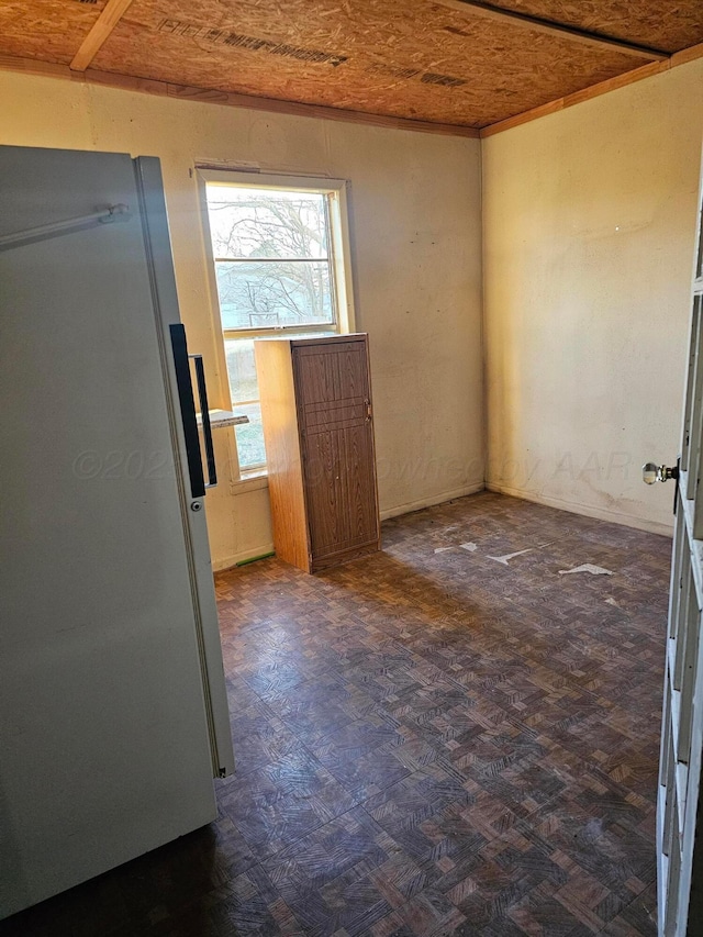 unfurnished room featuring dark parquet floors