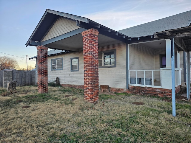 view of property exterior featuring a lawn