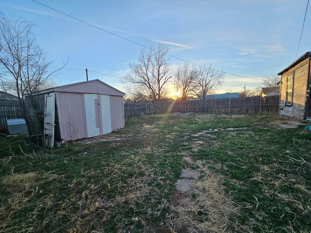 yard at dusk with a shed