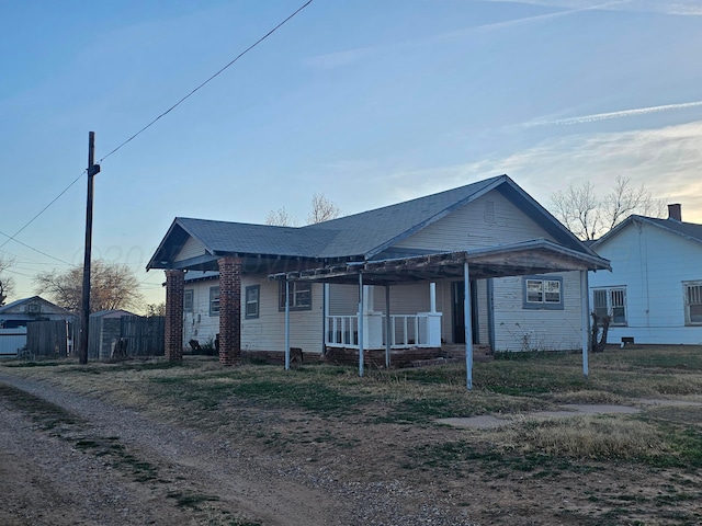 single story home featuring covered porch