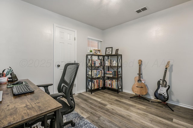 office space with hardwood / wood-style floors