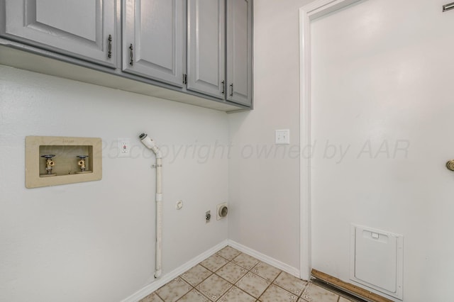 laundry area featuring cabinets, hookup for a washing machine, hookup for a gas dryer, and hookup for an electric dryer