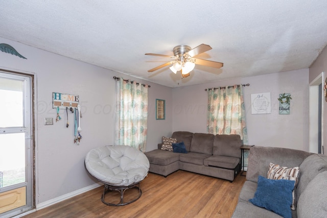 210 Oak Ave, Dumas, TX 79029 - living room featuring wood finished floors and ceiling fan