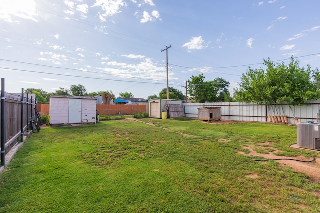 210 Oak Ave, Dumas, TX 79029 - fenced backyard featuring a storage unit