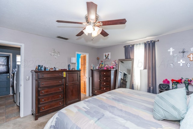 210 Oak Ave, Dumas, TX 79029 - bedroom with ceiling fan and light colored carpet