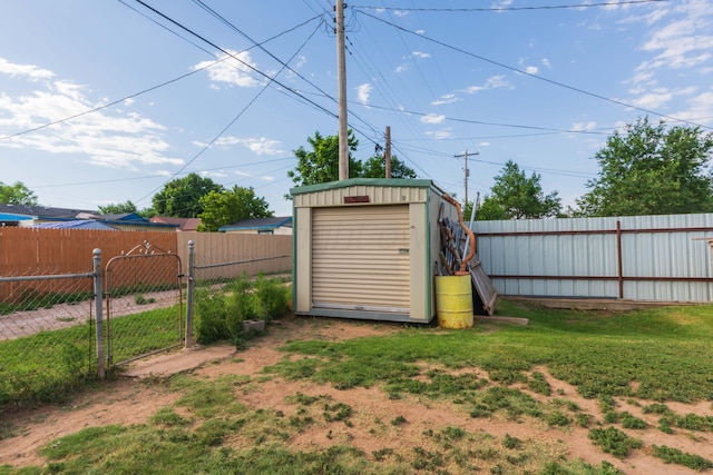210 Oak Ave, Dumas, TX 79029 - fenced backyard with a storage shed and a gate