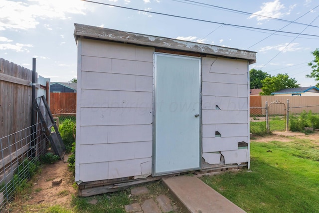 210 Oak Ave, Dumas, TX 79029 - view of shed featuring a fenced backyard