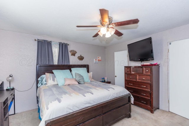 210 Oak Ave, Dumas, TX 79029 - bedroom with light colored carpet and ceiling fan