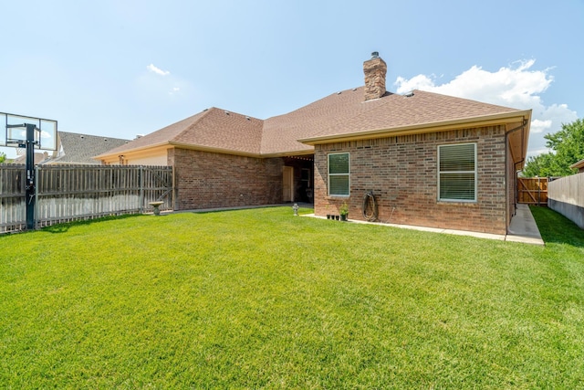 7601 Continental Pkwy, Amarillo, TX 79119 - rear view of property featuring brick siding, a fenced backyard, roof with shingles, and a chimney