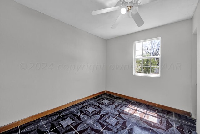 spare room with ceiling fan