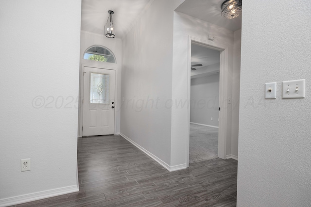 7703 Fresno Dr, Amarillo, TX 79118 - entrance foyer with dark wood finished floors, baseboards, and a textured wall