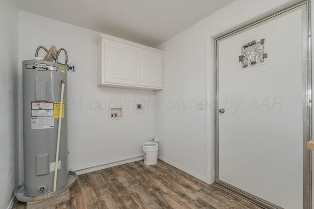 clothes washing area featuring cabinets, electric dryer hookup, electric water heater, dark hardwood / wood-style flooring, and hookup for a washing machine