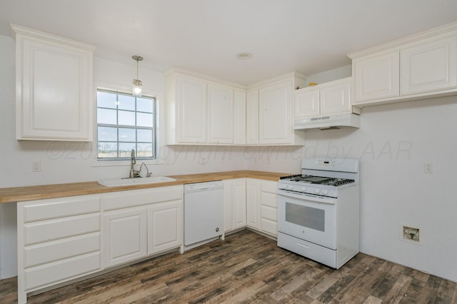 kitchen featuring sink, pendant lighting, white appliances, white cabinets, and custom range hood