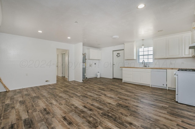 kitchen with white appliances, dark wood-type flooring, sink, tasteful backsplash, and white cabinetry