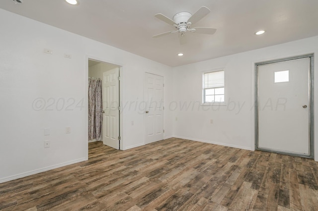 interior space featuring ceiling fan and dark wood-type flooring