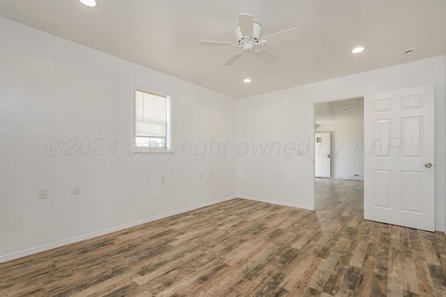 unfurnished room featuring hardwood / wood-style flooring and ceiling fan