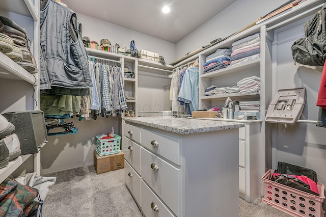 spacious closet featuring light carpet