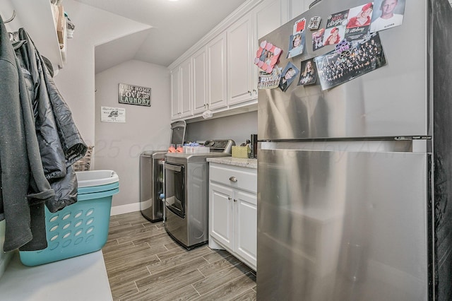 washroom with washer and dryer