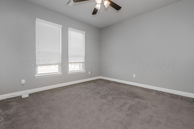 carpeted spare room with ceiling fan