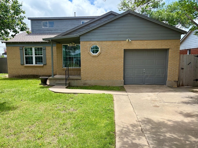 view of front of property with fence, a front lawn, brick siding, a garage, and driveway