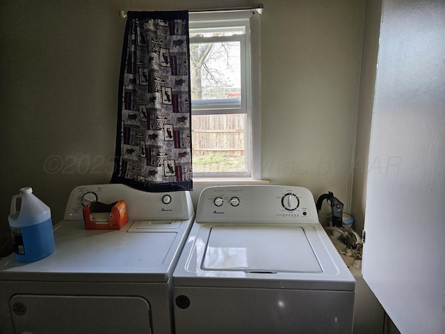 laundry area featuring washing machine and dryer and laundry area