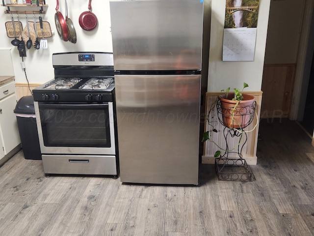 kitchen featuring wood finished floors and stainless steel appliances