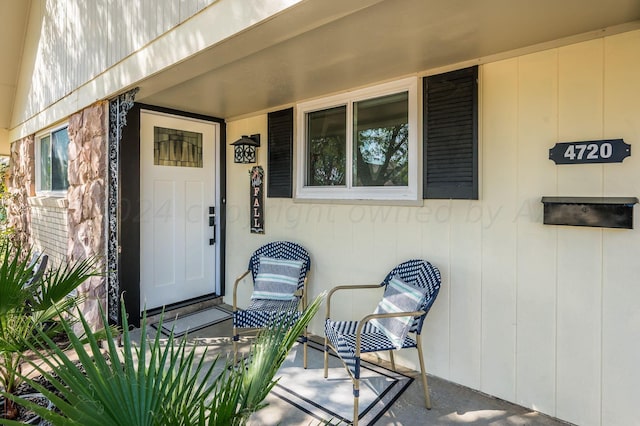 view of exterior entry with covered porch