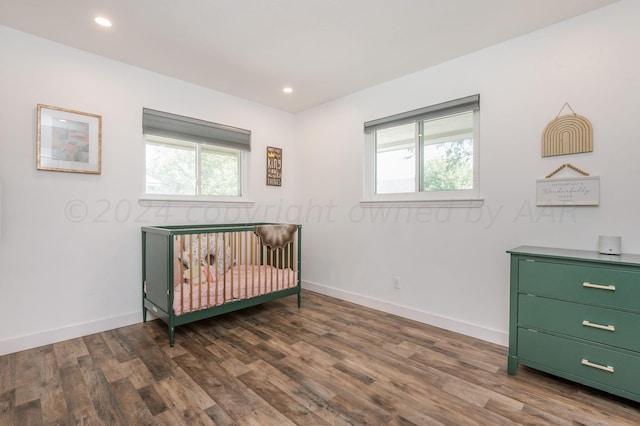 bedroom featuring recessed lighting, wood finished floors, and baseboards