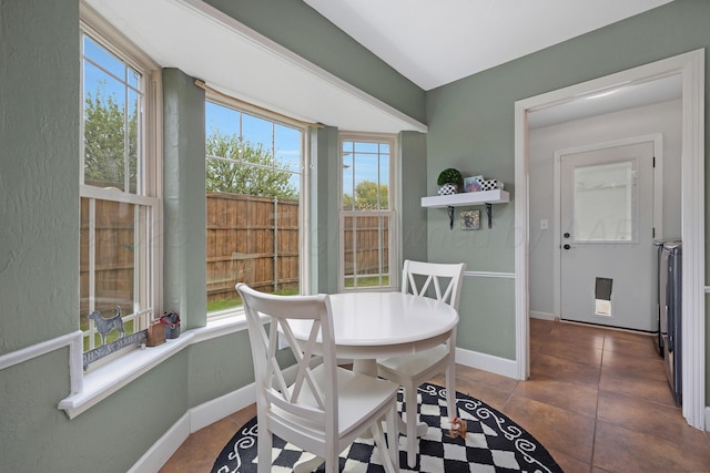 3101 SW 28th Ave, Amarillo, TX 79109 - tiled dining area with baseboards and a textured wall