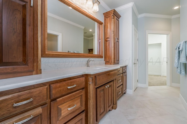 100 N Pratt St, Claude, TX 79019 - bathroom with tile patterned floors, vanity, ornamental molding, and baseboards