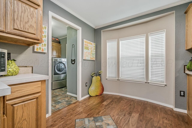 1228 S Osborne St, Pampa, TX 79065 - kitchen featuring washer / clothes dryer, wood finished floors, ornamental molding, light countertops, and baseboards