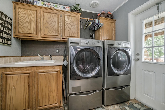 1228 S Osborne St, Pampa, TX 79065 - laundry room with washer and dryer, cabinet space, crown molding, and a textured ceiling