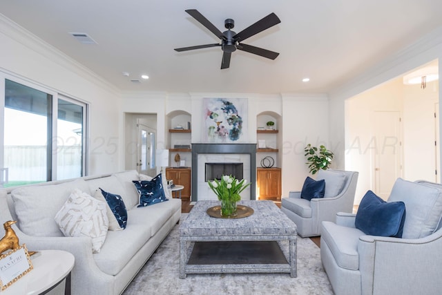 9504 Stonecrest Dr, Amarillo, TX 79118 - living room with crown molding, ceiling fan, a fireplace, recessed lighting, and wood finished floors