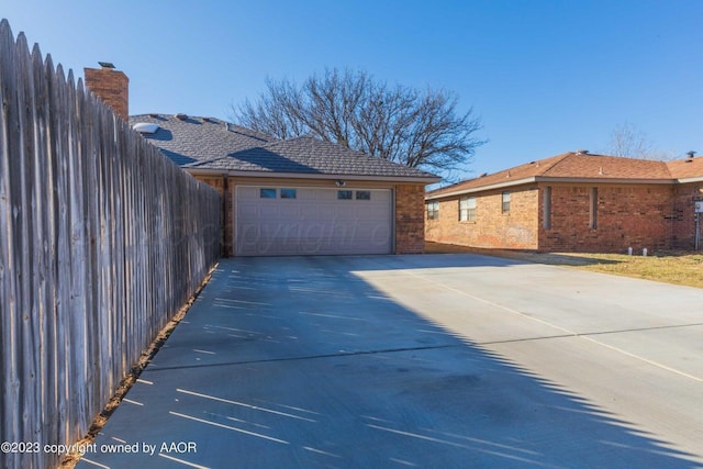 6810 Montague Dr, Amarillo, TX 79109 - garage featuring concrete driveway