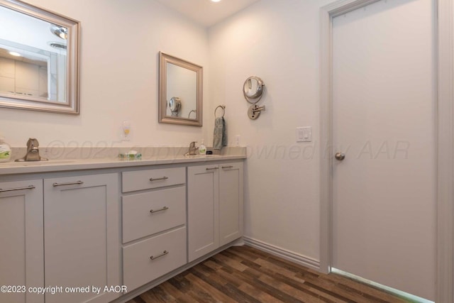 6810 Montague Dr, Amarillo, TX 79109 - full bathroom featuring double vanity and wood finished floors