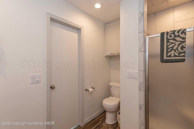 6810 Montague Dr, Amarillo, TX 79109 - full bathroom featuring wood finished floors and a shower stall