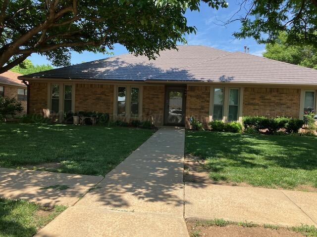6810 Montague Dr, Amarillo, TX 79109 - single story home with brick siding and a front yard