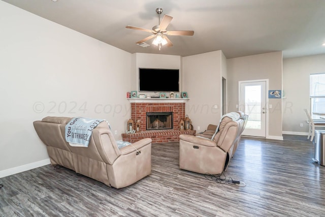 1841 Vidalia St, Amarillo, TX 79118 - living area featuring wood finished floors, baseboards, ceiling fan, and a brick fireplace