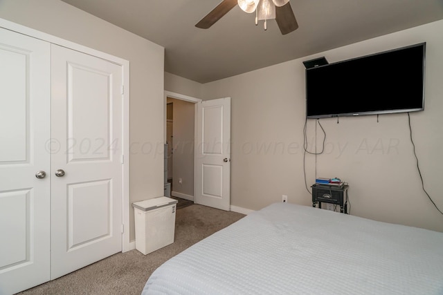 bedroom featuring ceiling fan, a closet, and carpet floors