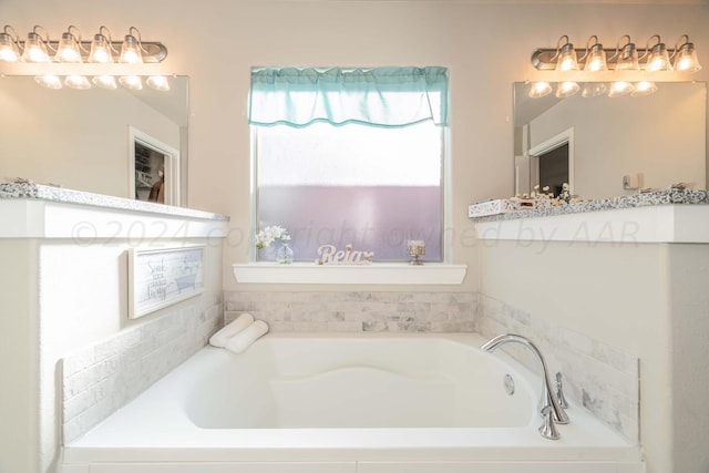 bathroom with tiled bath